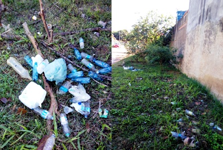 Calçada gramada com descarte irregular de lixo em Regência. Horroroso, diz moradora